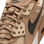 Details the micro-precision of the forefoot area, showing the durable ripstop toe box, reinforced synthetic toe bumper, tonal laces, and rugged lace loops.