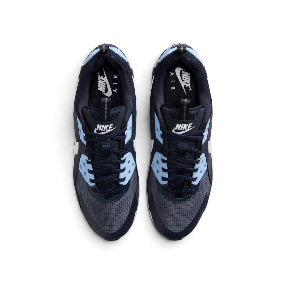 Overhead view of both sneakers showing the ripstop toe boxes, central lacing systems, and branded tongue labels.