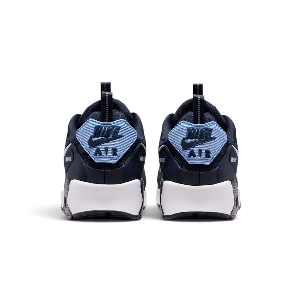 Rear view of the sneakers emphasizing the molded heel badges, visible Max Air windows, and rugged sole wraps.