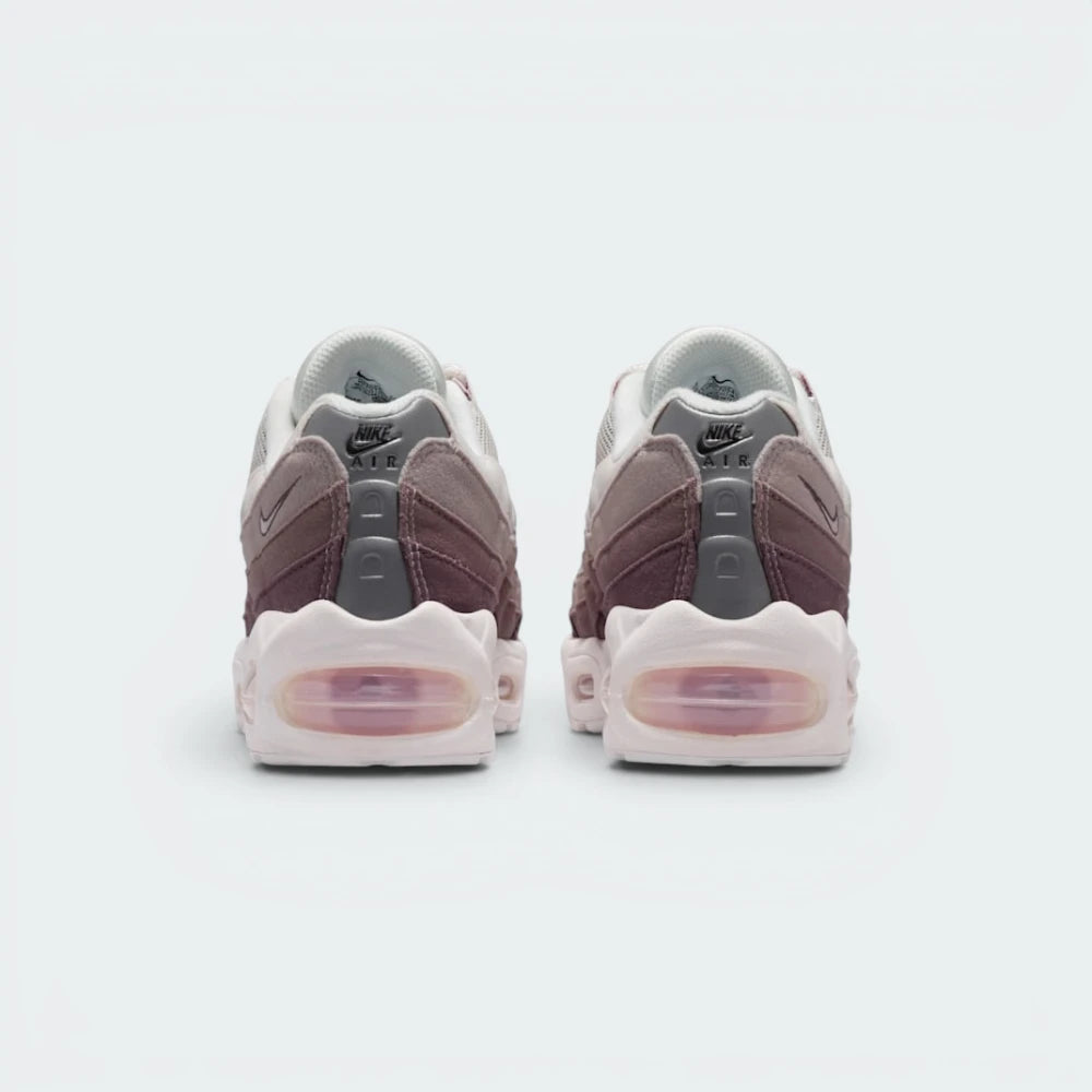 Focuses on the contoured shape of the low-cut ankle collar, highlighting the reflective heel panel detailing and the vertical spine-inspired structural lines running down the rear.