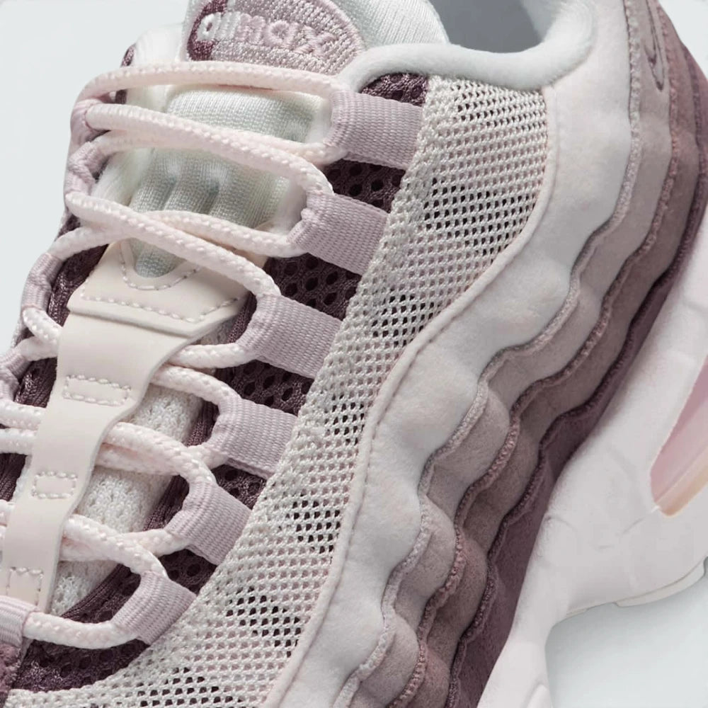 Details the premium stitching wrapping the durable front toe cap protection matrix and the neat configuration of the speed-lacing eyelet loops.