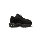 Highlights the lateral profile showing the layered wavy black leather muscle panels, breathable mesh upper, mini tonal embroidered heel Swoosh, sculpted black foam midsole, and visible Max Air heel chamber.