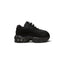 Highlights the lateral profile showing the layered wavy black leather muscle panels, breathable mesh upper, mini tonal embroidered heel Swoosh, sculpted black foam midsole, and visible Max Air heel chamber.