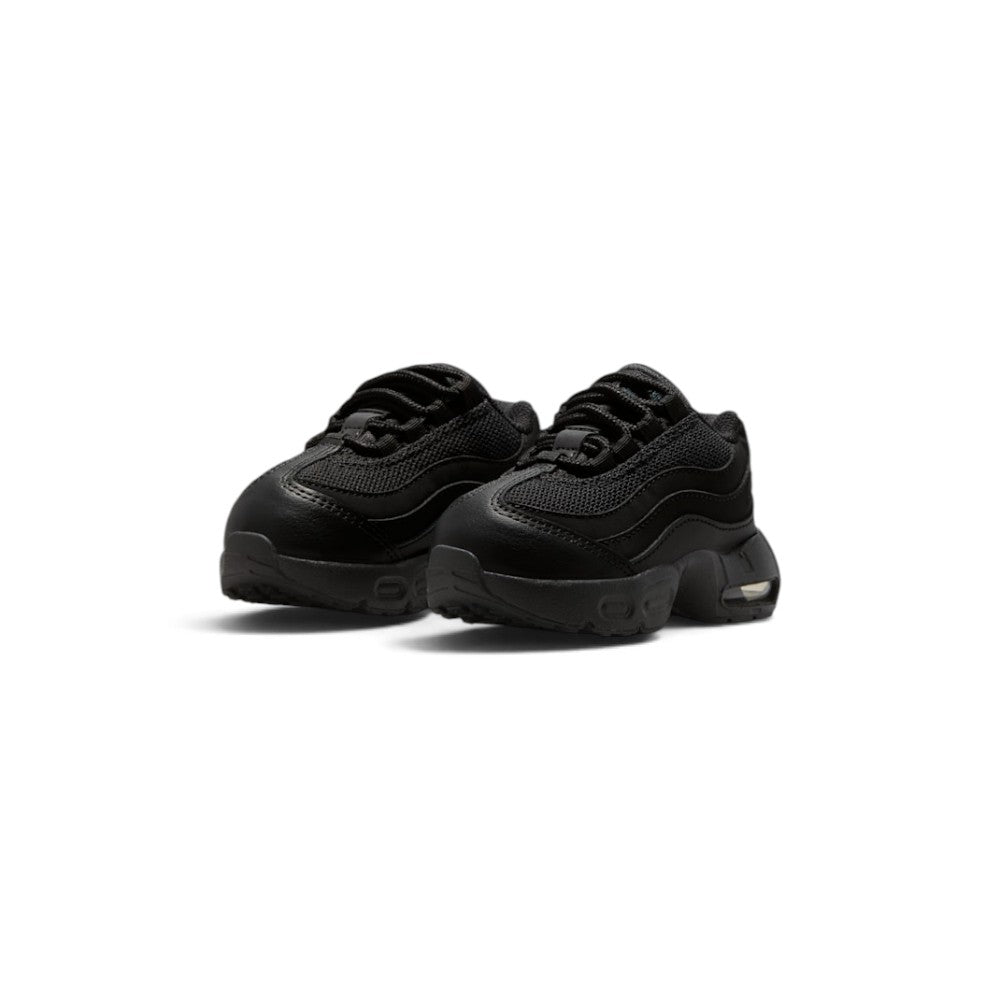 Emphasising the sturdy, structured three-quarter stance of the toddler shoes and the clean textural contrast between the smooth leather side waves, breathable mesh, and thick foam midsole.