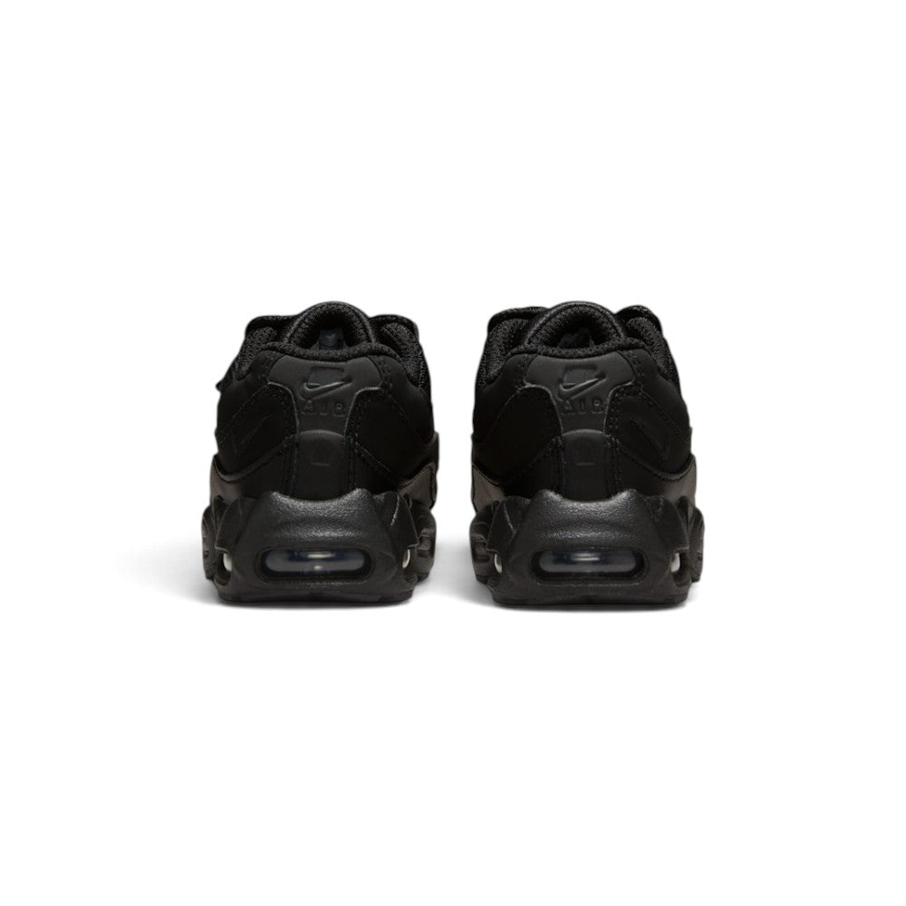Focuses on the rear profile, displaying the layered black leather heel counters with debossed "NIKE AIR" logos, vertical spine panels, and the solid base of the foam midsole enclosing the Max Air windows.