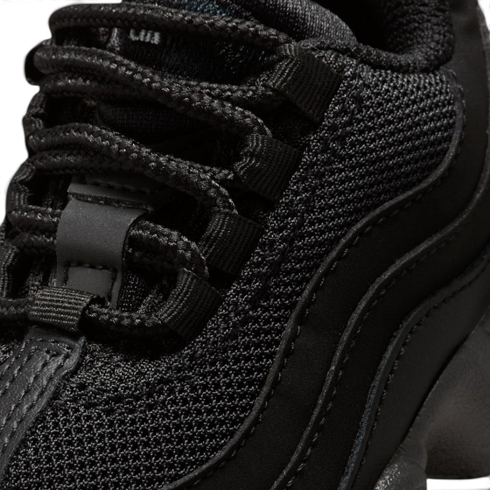 Details the micro-precision of the forefoot area, showing the fine-gauge black mesh toe box, double-stitched leather toe bumper, round laces, and heavy-duty ribbed eyelet straps.