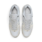 Focuses on the locked-in central lacing layout, displaying the light grey mesh tongues, matching laces, off-white suede eyestay overlays, mini black Swoosh on the toe guard, and light grey insoles with white Nike branding.