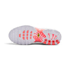 Displays the full-length white rubber outsole, showcasing the Hot Lava siped traction pods, deep forefoot flex grooves, central yellow hexagonal "Tn Air" badge, and visible internal cushioning channels.