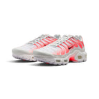 Emphasising the aggressive, curved stance of the junior trainers and the energetic glow of the Hot Lava cage lines against the clean white mesh upper.