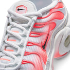 Details the micro-precision of the forefoot area, showing the fine-weave white mesh toe box, shiny clear-coated toe bumper, white laces through Hot Lava eyelet loops, and the branded tongue patch.