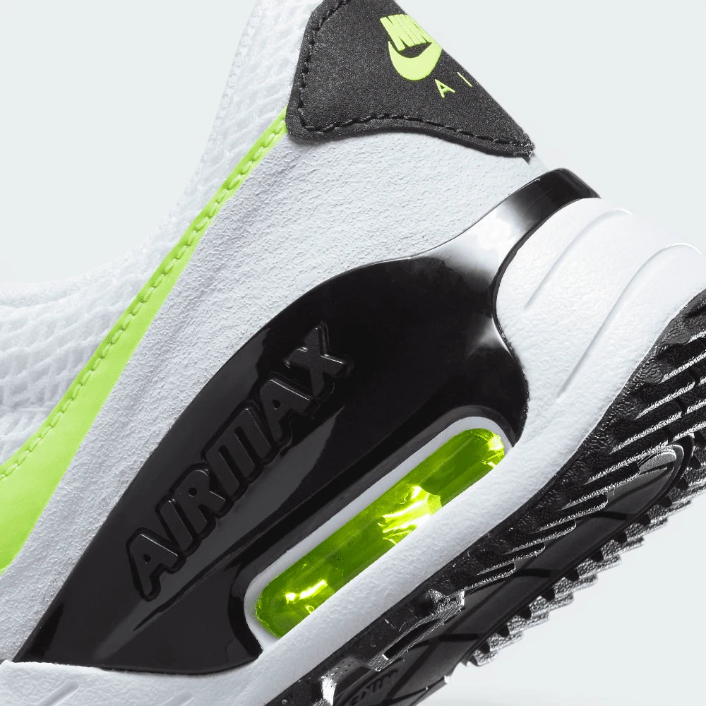 Highlights the "unreal" clean finish where the thick foam cushioning carrier meets the durable rubber traction base, framing the clear heel Air pocket.