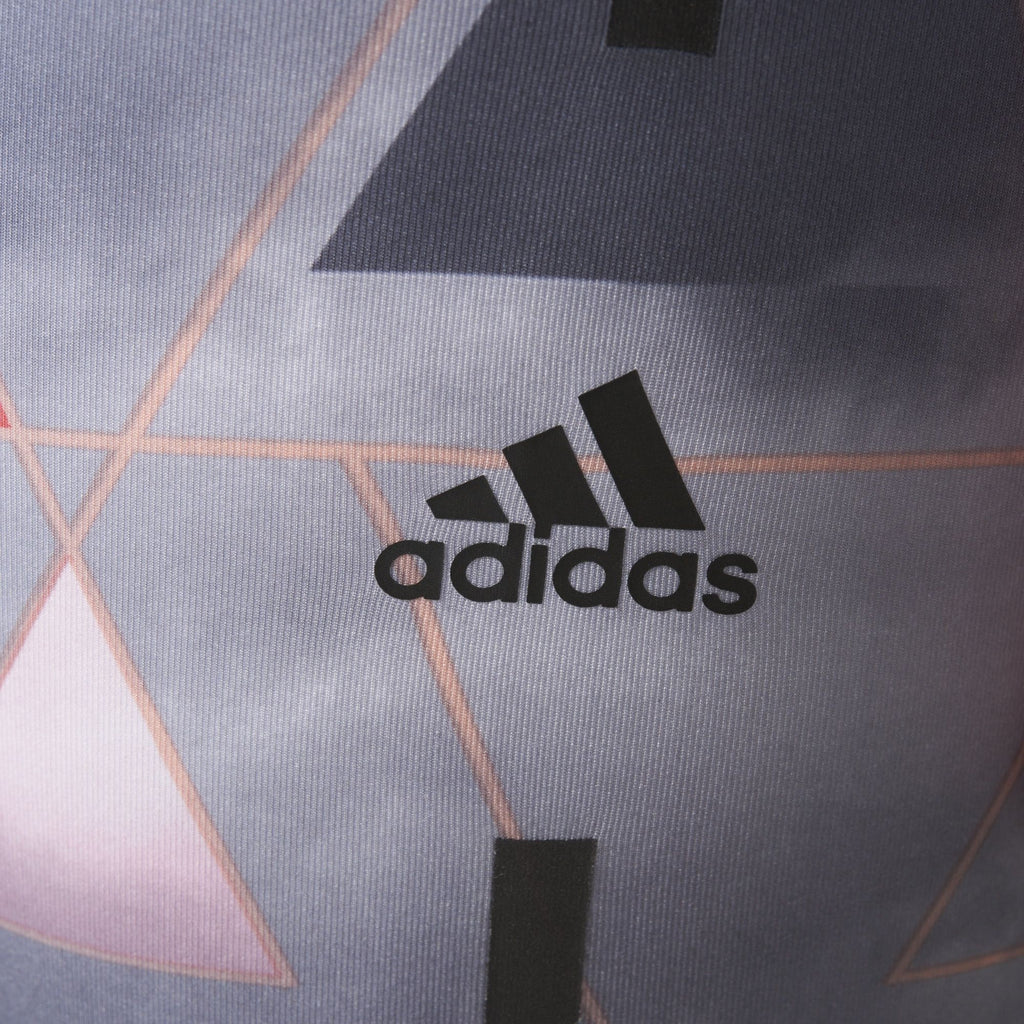 Highlighting the "unreal" precision of the heat-transferred Adidas logo on the hip.