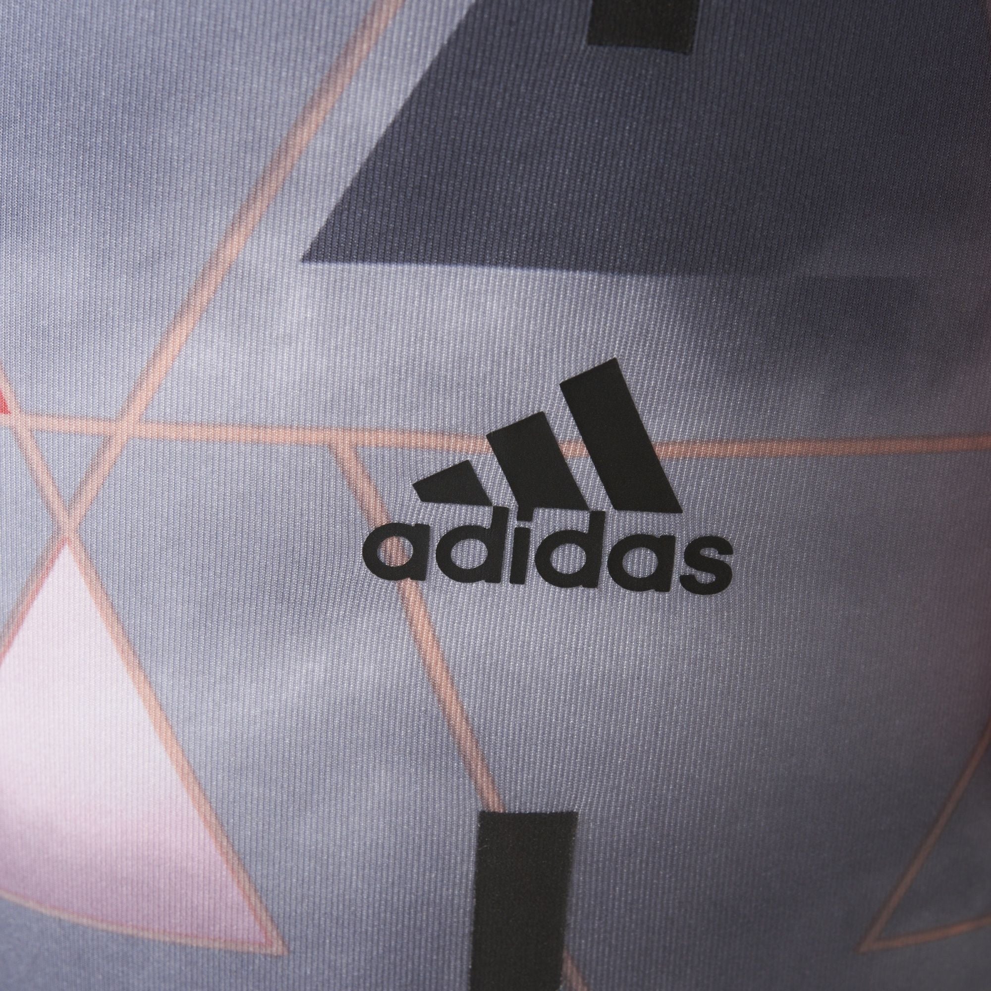 Highlighting the "unreal" precision of the heat-transferred Adidas logo on the hip.