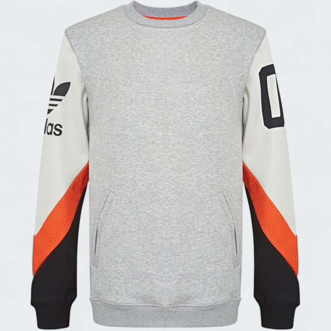 Adidas Crew Basketball Sweatshirt in grey fleece, front view showing ribbed crewneck, cuffs, and hem, with a subtle Adidas logo.