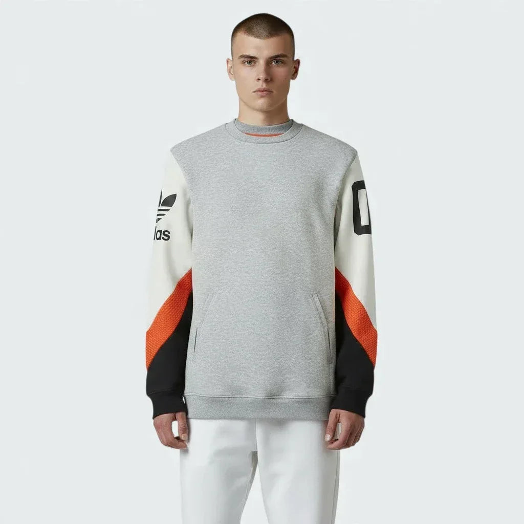 Adidas Crew Basketball Sweatshirt in grey fleece, front view showcasing the plain design and comfortable fit.