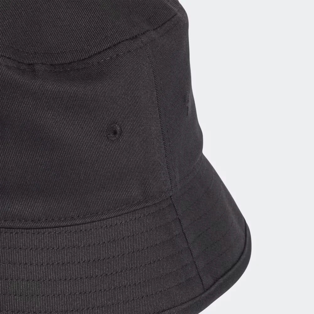 Highlighting the rows of decorative and structural stitching on the flexible brim.