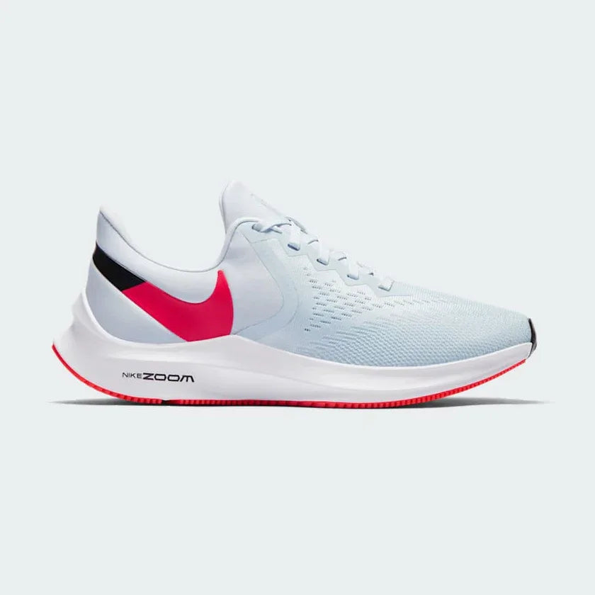 Nike Zoom Winflo 6 Women's running trainers in blue with red and black accents, side profile showing mesh upper, Zoom Air cushioning, and Nike Swoosh. Main image