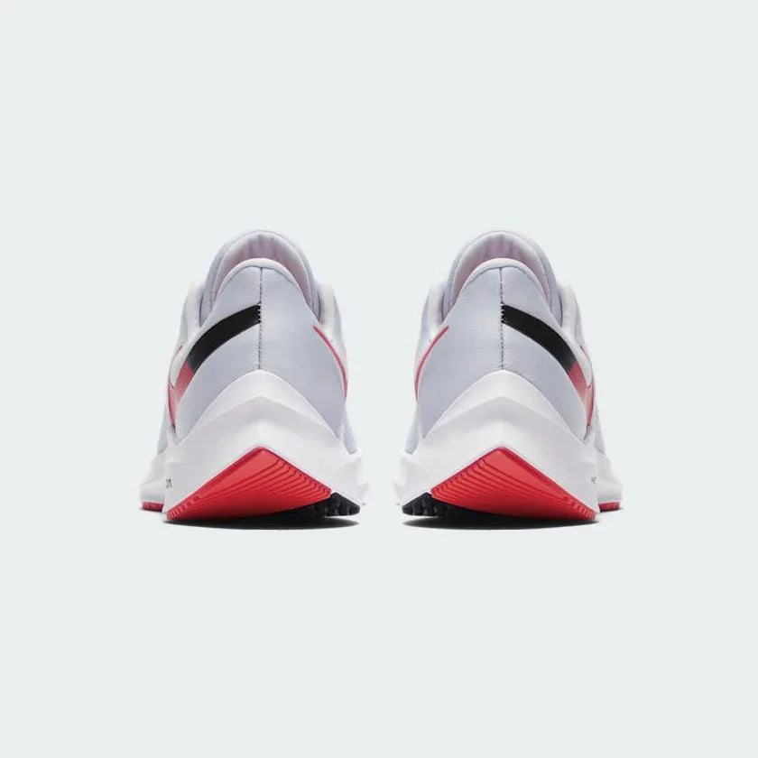 Rear view of the Nike Zoom Winflo 6 Women's blue running trainers, focusing on the structured heel and subtle branding.