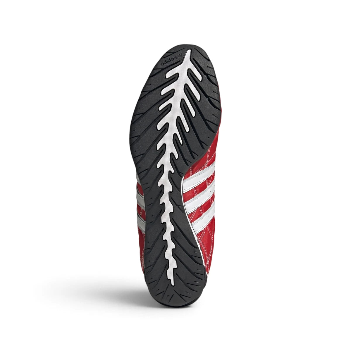 Bottom-down view of the rubber outsole, showcasing the low-profile tread pattern, pivot points, and the carbon insert window.
