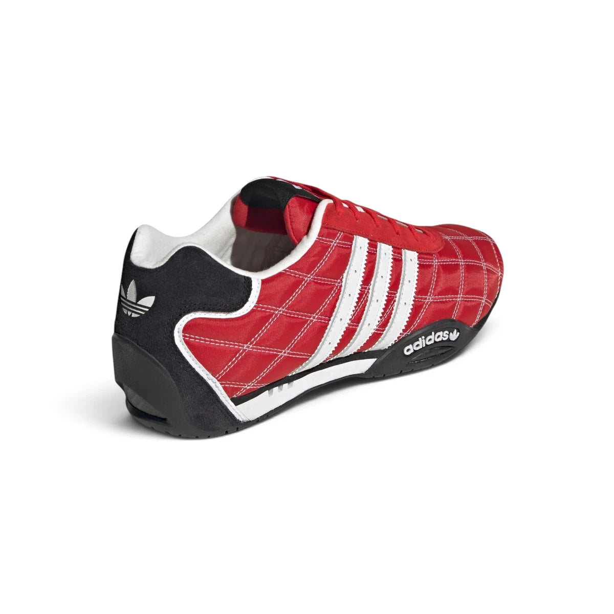Rear-facing perspective focusing on the structured heel counter, reflective heel piping, and clean sole edge wrap.