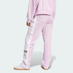 Focusing on the clean athletic drape and the way the fabric stacks over low-profile sneakers.