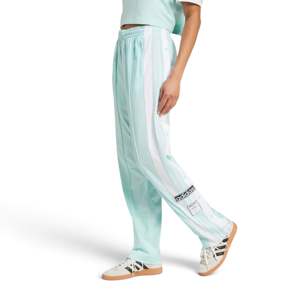 The Semi Flash Aqua Adibreak pants, highlighting the full-length white snap buttons and the contrast 3-Stripes against the bright aqua base.