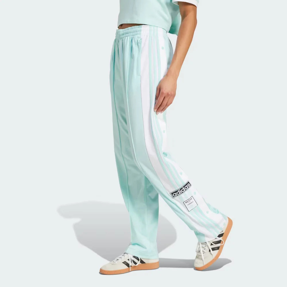 The Semi Flash Aqua Adibreak pants, highlighting the full-length white snap buttons and the contrast 3-Stripes against the bright aqua base. Main image