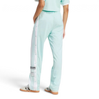 Focusing on the clean athletic drape and the way the fabric stacks over low-profile sneakers.