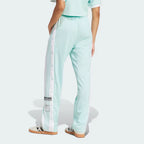 Focusing on the clean athletic drape and the way the fabric stacks over low-profile sneakers.