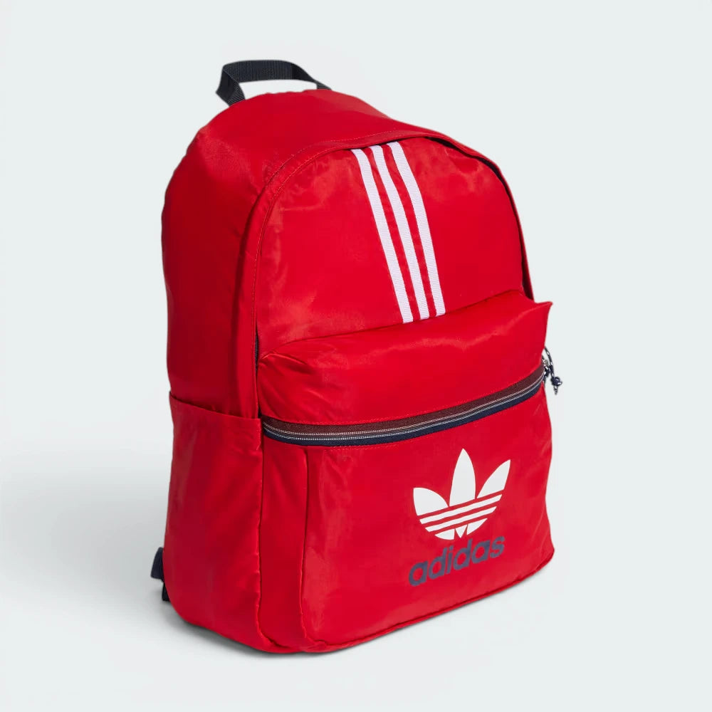 Focuses on the full front profile, showcasing the sharp contrast of the large white printed retro Trefoil logo and the classic 3-Stripes against the vibrant Better Scarlet background canvas.