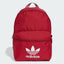 Red Adidas backpack on a light gray background