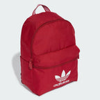 Side profile of the Team Victory Red Adidas backpack, highlighting the slim profile and the padded adjustable straps.