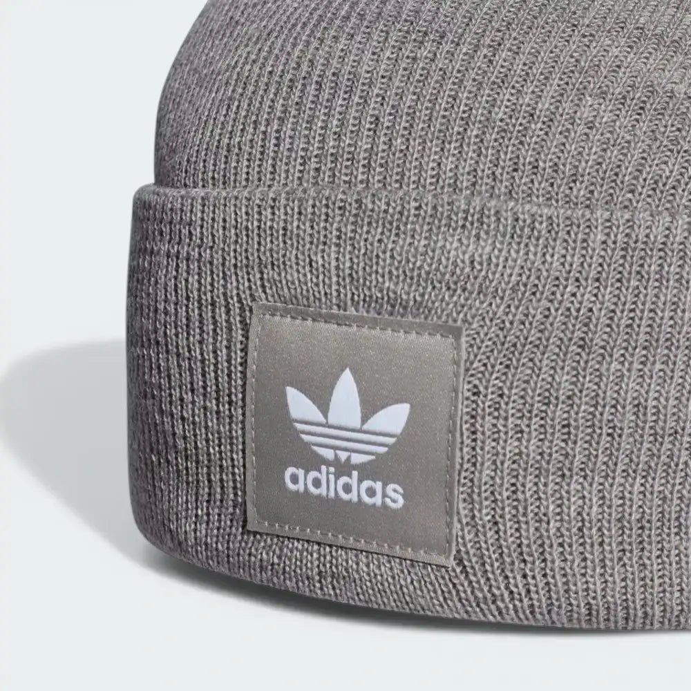 Zoom looking at the Trefoil patch, showcasing the precision of the embroidery and the signature Adidas branding.