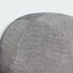 Top-down view of the beanie, showcasing the structured top seam and the circular construction.