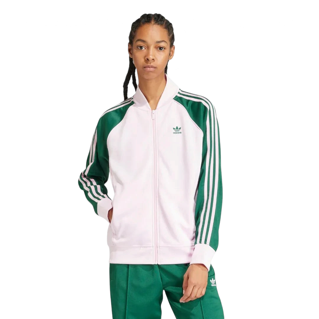 Adidas Adicolor Classics Loose Superstar Track Jacket Women's in clear pink, front view showing the loose fit, full zip, ribbed bomber collar, and embroidered Trefoil logo.