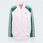 Adidas Adicolor Classics Loose Superstar Track Jacket Women's in clear pink, front view showing the loose fit, full zip, ribbed bomber collar, and embroidered Trefoil logo.