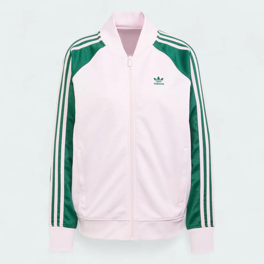 Adidas Adicolor Classics Loose Superstar Track Jacket Women's in clear pink, front view showing the loose fit, full zip, ribbed bomber collar, and embroidered Trefoil logo.