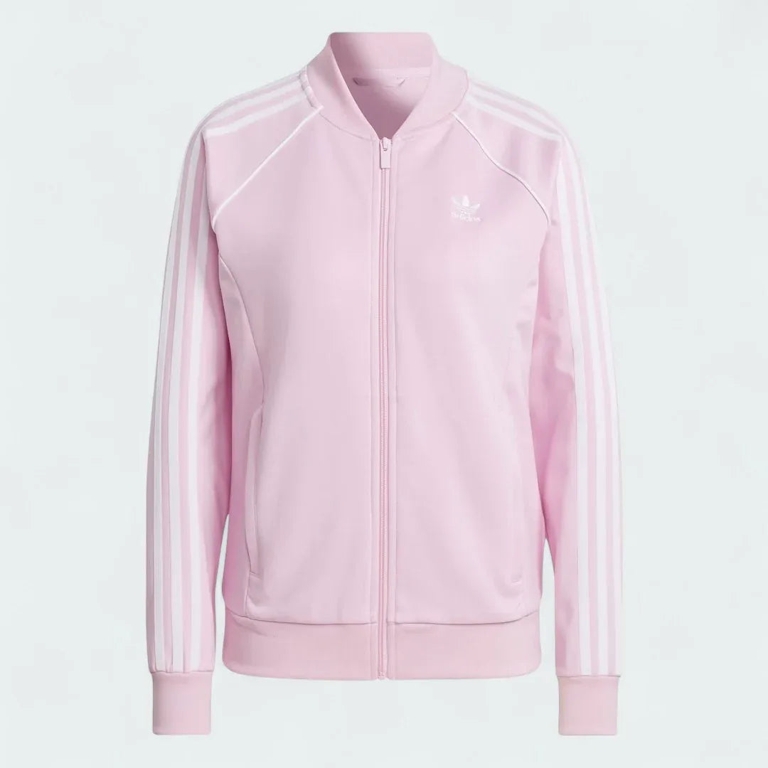 Adidas Adicolor Classics Superstar Track Jacket in orchid fusion pink, front view showing full zip, stand-up collar, white 3-Stripes on sleeves, and embroidered Trefoil logo.