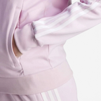 Detailed zoom on the lower part of the jacket featuring the pocket and cuffed sleeves