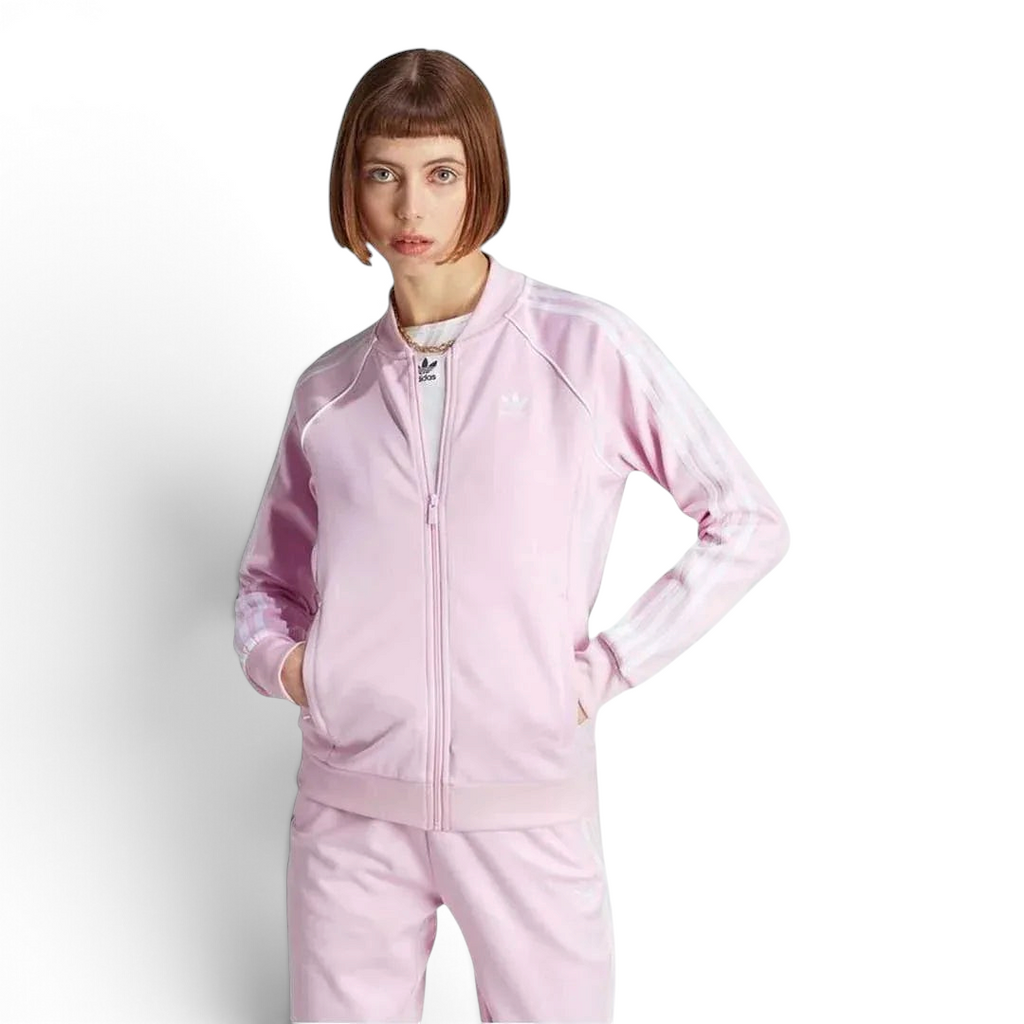 Adidas Adicolor Classics Superstar Track Jacket in orchid fusion pink, front view showing full zip, stand-up collar, white 3-Stripes on sleeves, and embroidered Trefoil logo.