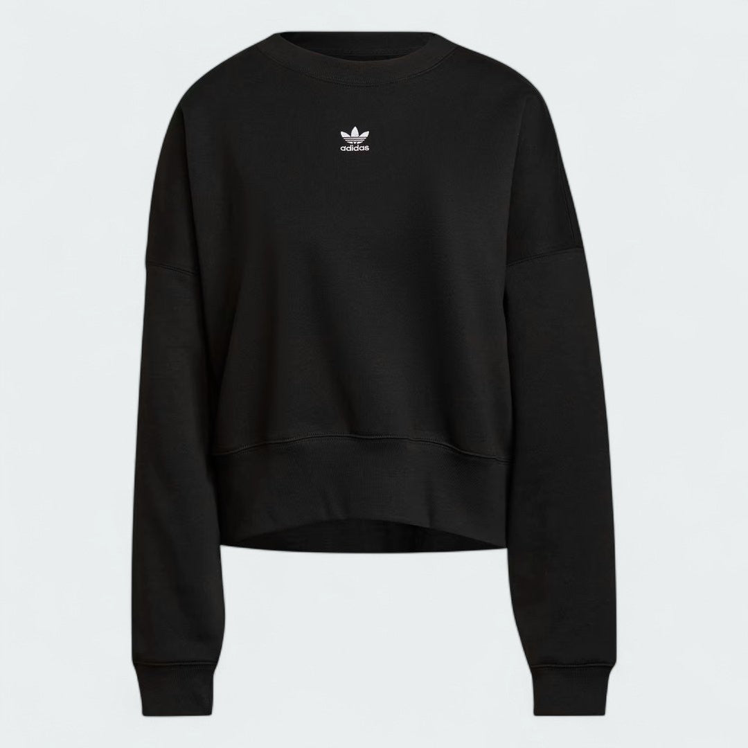 Adidas Adicolor Essentials Fleece Crew Sweatshirt Women's in black, front view showing the ribbed crewneck, cuffs, and hem, and a small Adidas Trefoil logo on the chest.