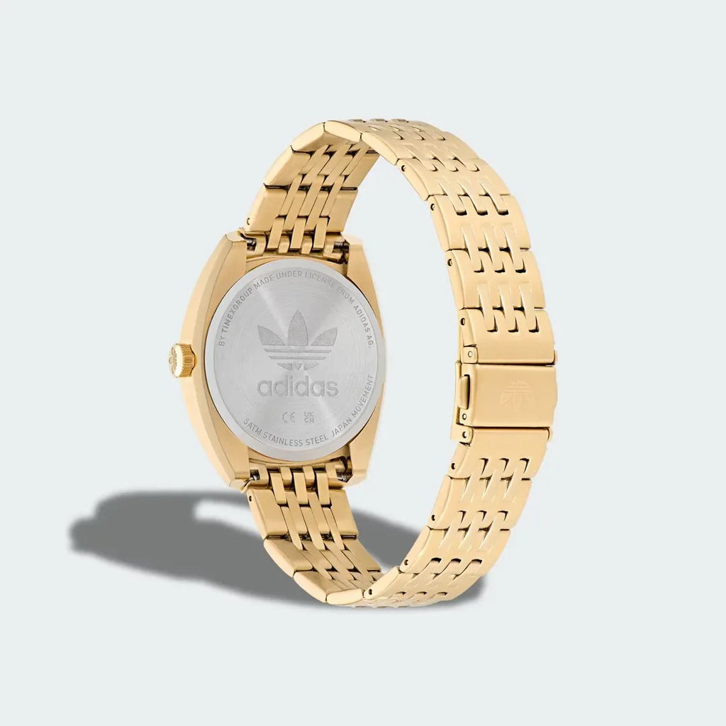 Close-up detail of the stainless steel bracelet on the Adidas Edition One Watch, showing the fold-over clasp and link texture.