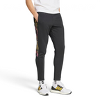 Adidas Tiro Running Track Pants in black, front view showing the tapered leg, elastic drawcord waist, and front zip pockets.