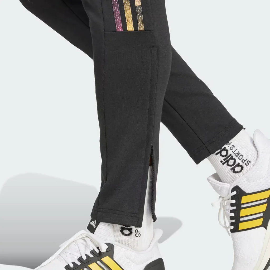 Detailed zoom on the ankle zips of the Adidas Tiro Running Track Pants, highlighting the adjustable fit and functional details.
