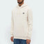 Highlights the clean, smooth drop of the shoulder seams and the professional, plush texture of the Ecru fleece fabric body, showing the neat alignment of the ribbed cuffs and the structured drape of the sleeve.