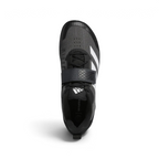 Focuses on the locked-in lace configuration and the broad texture of the wide hook-and-loop midfoot strap.