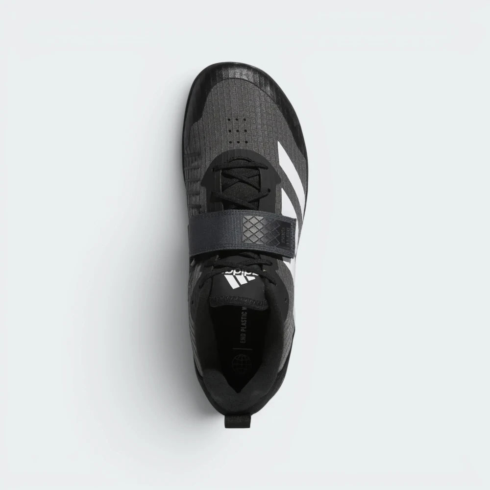 Focuses on the locked-in lace configuration and the broad texture of the wide hook-and-loop midfoot strap.