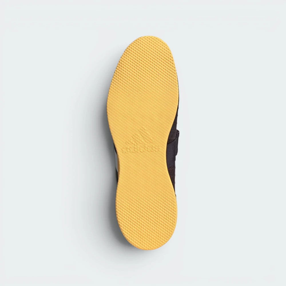 Displays the specialised flat-profile geometric traction pattern of the low-profile rubber sole, engineered for unreal floor contact and a zero-slip mat plant.