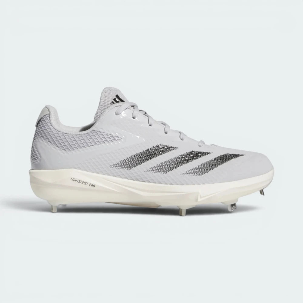 Highlights the high-velocity sweep of the Team Light Grey upper, showing the crisp execution of the Core Black 3-Stripes, the low-cut ankle collar, and the sleek profile of the cleated outsole. Main image