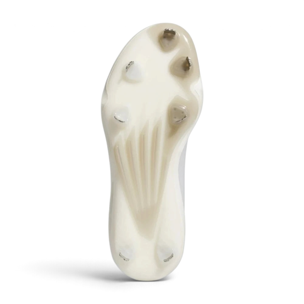 Displays the high-traction cleat arrangement on the synthetic outsole, showcasing the aggressive stud configuration engineered for unreal bite and dig on baseball clay and grass.
